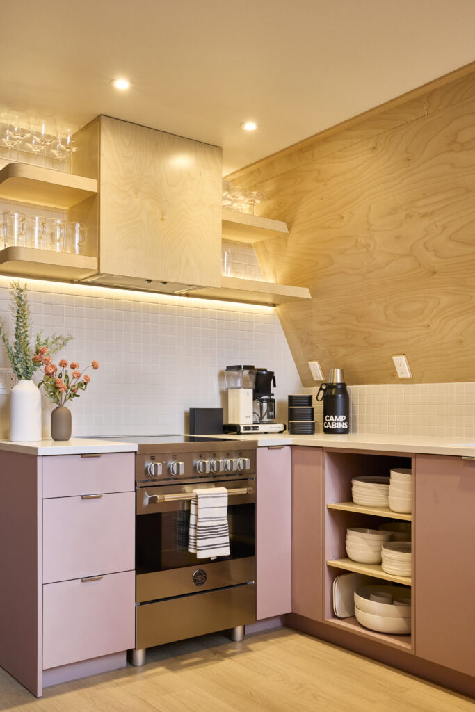 Kitchen with a Bertazzoni induction range and open shelving